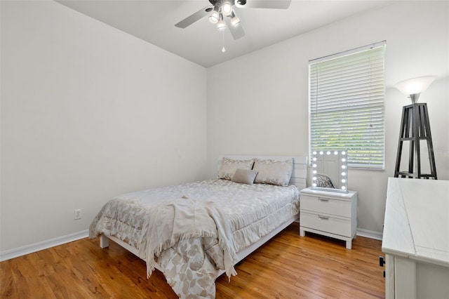 bedroom featuring ceiling fan and light hardwood / wood-style floors