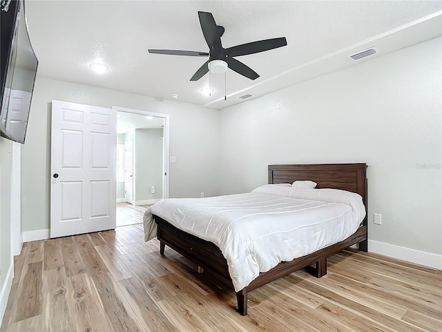 bedroom featuring ceiling fan and light hardwood / wood-style floors