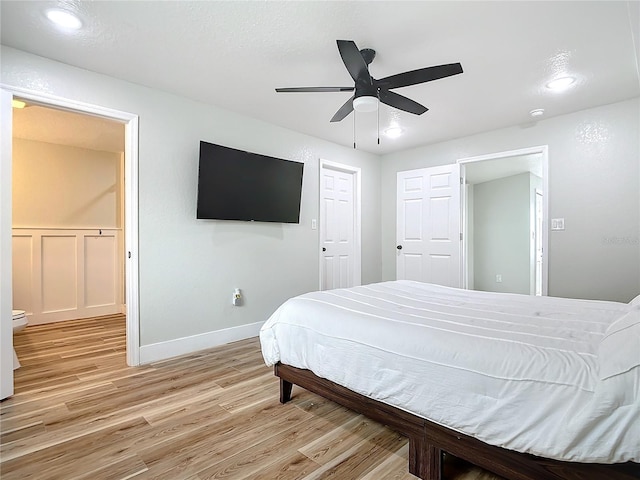 bedroom featuring ceiling fan and light wood-type flooring