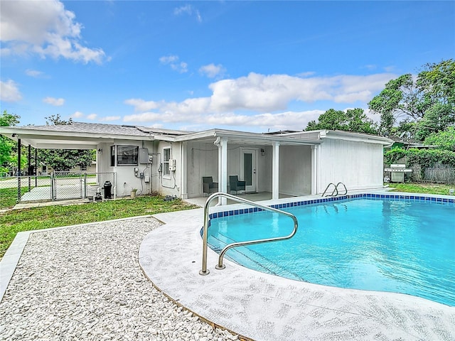 view of swimming pool with a patio area