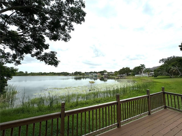 wooden deck featuring a water view