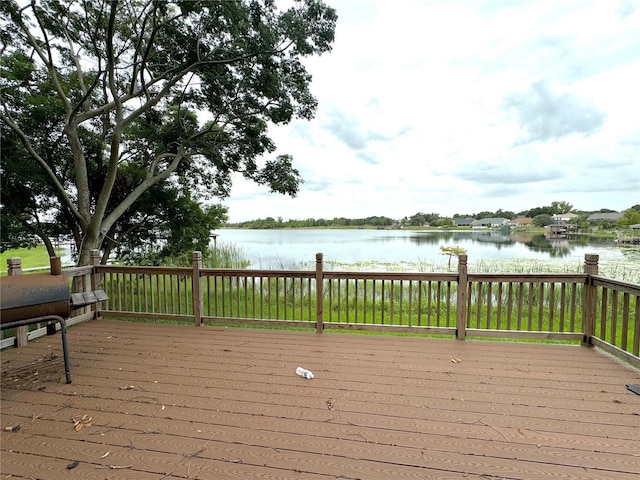 wooden deck with a water view