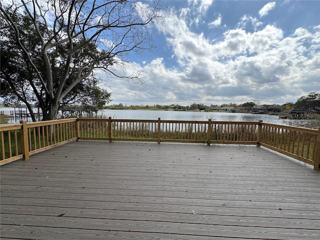 wooden deck featuring a water view