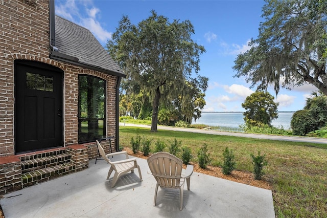 view of patio / terrace with a water view