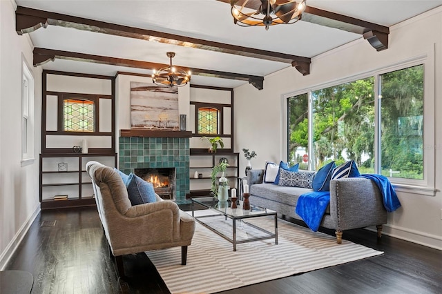 living room with baseboards, dark wood-style floors, beamed ceiling, a fireplace, and a notable chandelier