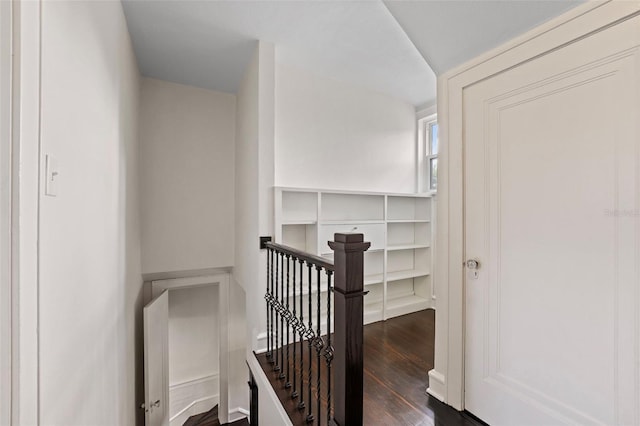 corridor featuring dark wood-type flooring