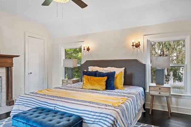 bedroom with wood-type flooring, lofted ceiling, and ceiling fan