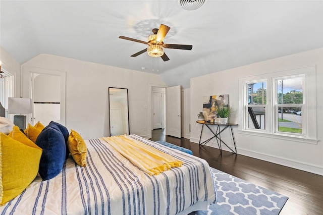 bedroom with wood-type flooring, ceiling fan, and vaulted ceiling