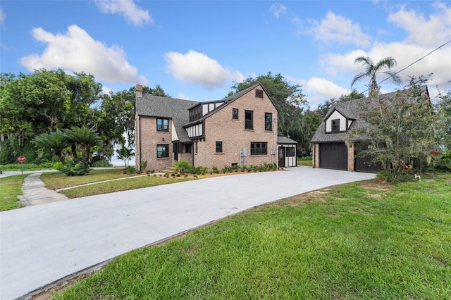 view of front of home featuring a garage and a front lawn