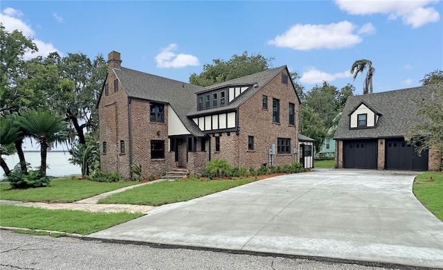 view of front facade with a garage and a front lawn