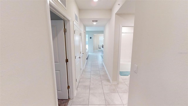 corridor with light tile patterned floors