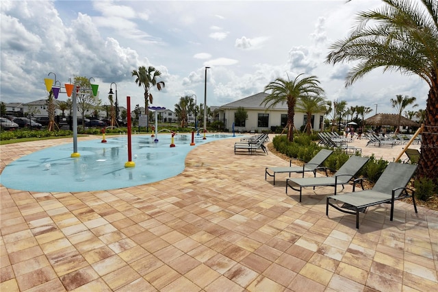 view of swimming pool with a patio area