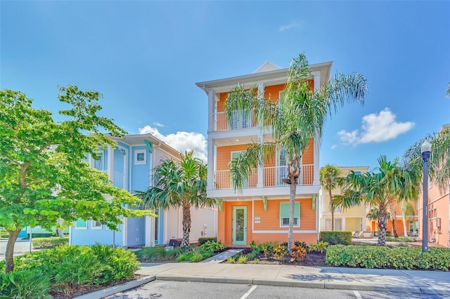 view of front of property with a balcony