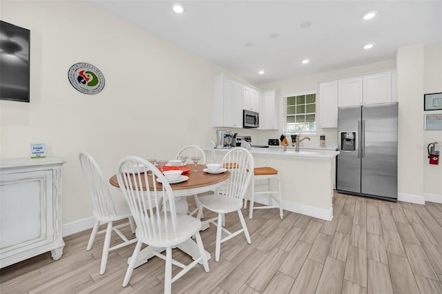 dining room featuring light wood-type flooring