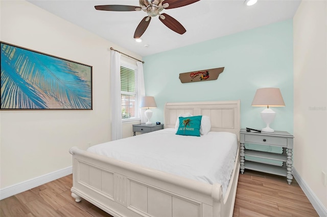 bedroom featuring light hardwood / wood-style flooring and ceiling fan