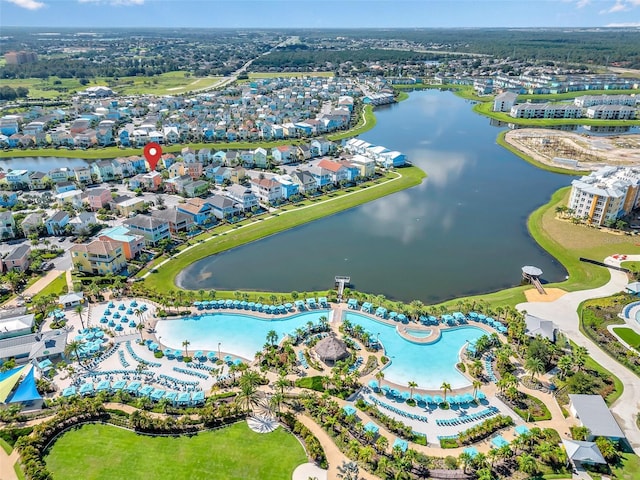 birds eye view of property with a water view