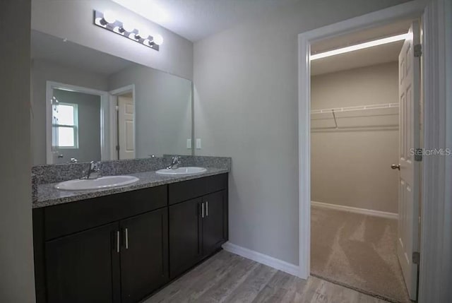 bathroom featuring vanity and hardwood / wood-style floors