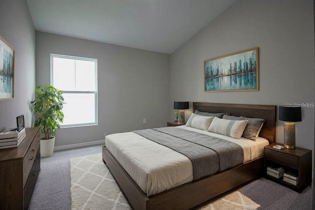 carpeted bedroom featuring lofted ceiling