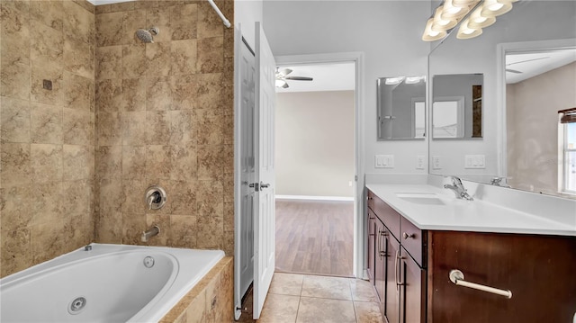 bathroom featuring vanity, ceiling fan, tiled shower / bath combo, and tile patterned flooring