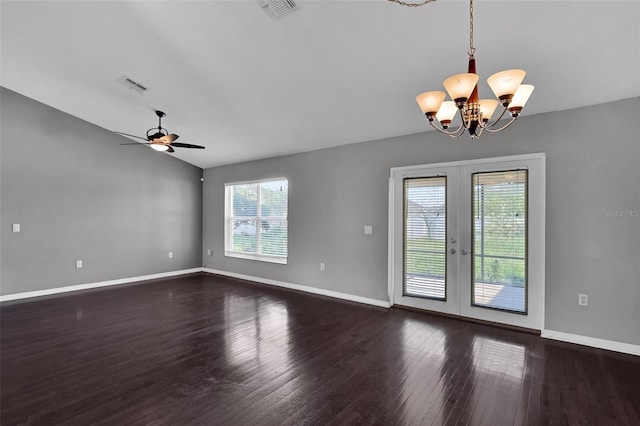 unfurnished room featuring dark wood-type flooring, lofted ceiling, ceiling fan with notable chandelier, and french doors