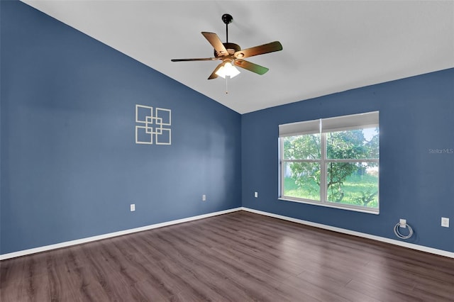 empty room featuring hardwood / wood-style flooring, ceiling fan, and lofted ceiling