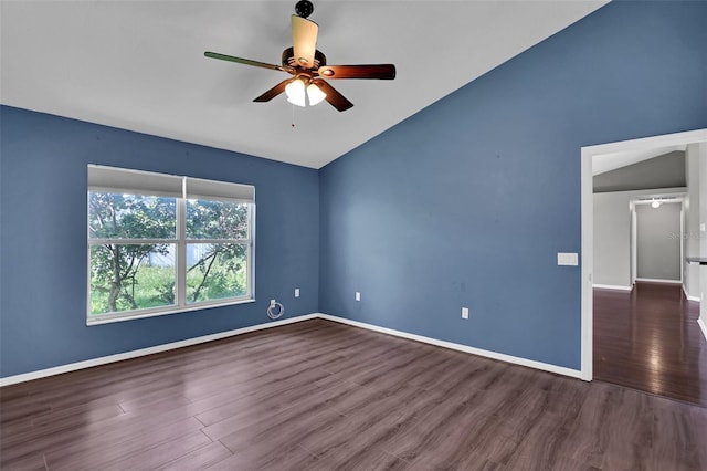 unfurnished room with ceiling fan, dark hardwood / wood-style flooring, and vaulted ceiling