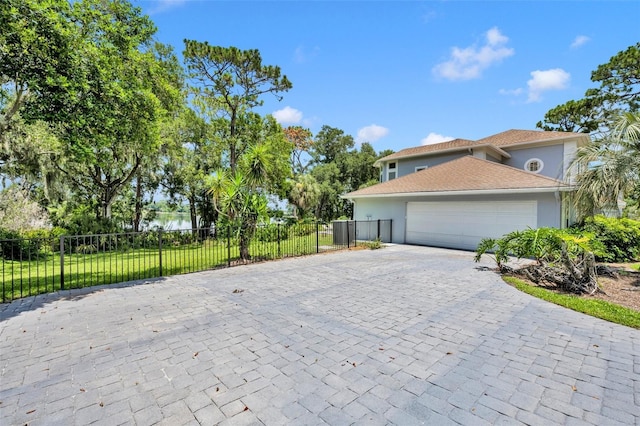 view of home's exterior with a garage and a yard