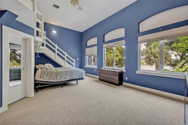 carpeted bedroom featuring ceiling fan