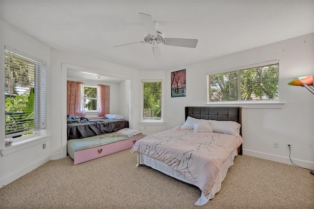 carpeted bedroom featuring ceiling fan