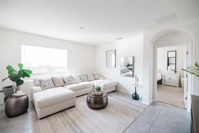 living room with light tile patterned floors