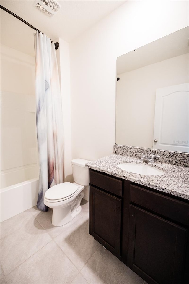 full bathroom with tile patterned floors, vanity, toilet, and shower / tub combo with curtain