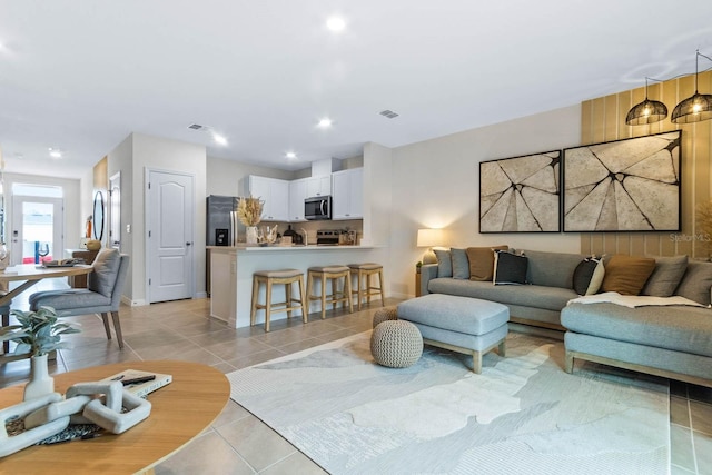 living room featuring light tile patterned floors