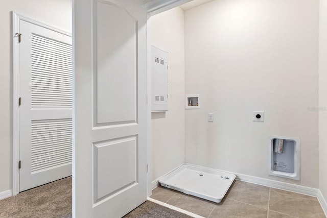 laundry room with light tile patterned floors, hookup for a washing machine, and hookup for an electric dryer