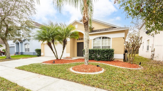 view of front facade with a front yard and a garage