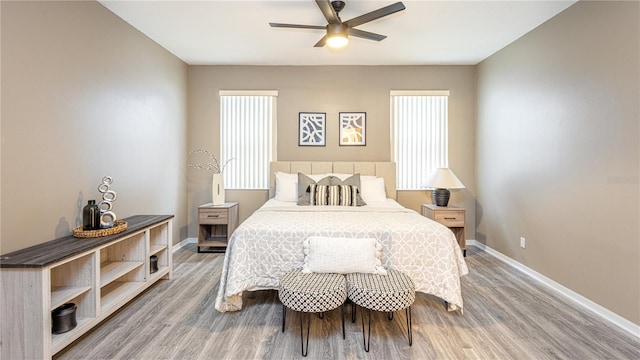 bedroom with ceiling fan and wood-type flooring