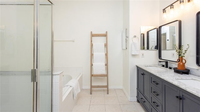 bathroom with tile patterned floors, vanity, and shower with separate bathtub