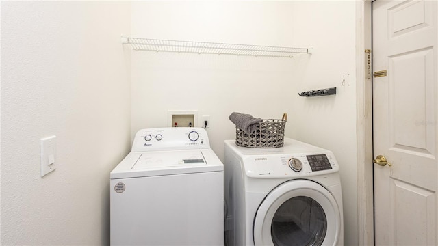 washroom featuring washing machine and dryer