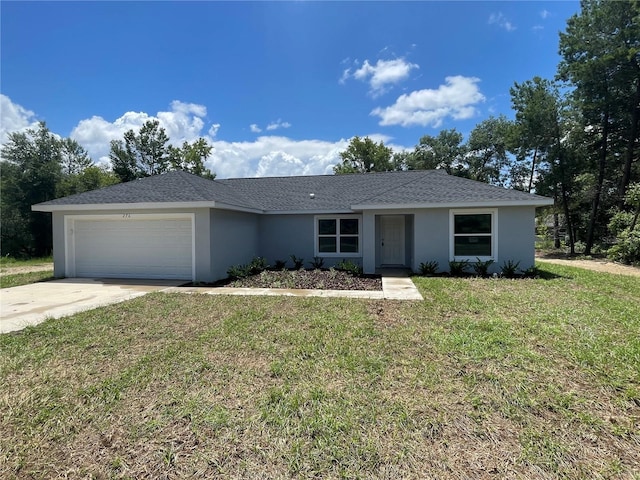 ranch-style house with a garage, concrete driveway, a front yard, and stucco siding