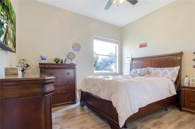 bedroom with ceiling fan and light wood-type flooring