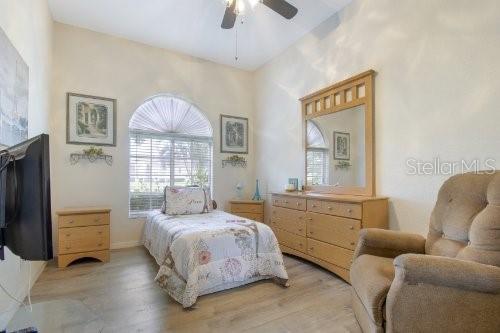 bedroom featuring light hardwood / wood-style floors and ceiling fan