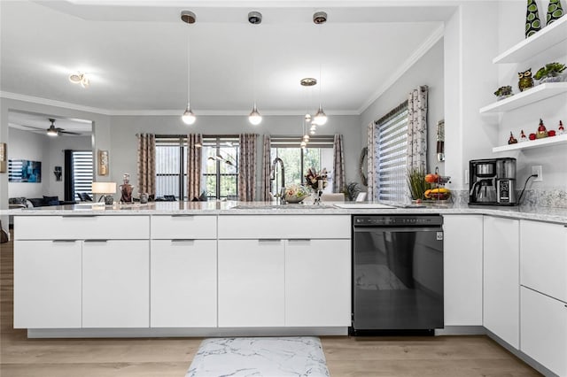 kitchen featuring light hardwood / wood-style floors, sink, black dishwasher, and kitchen peninsula