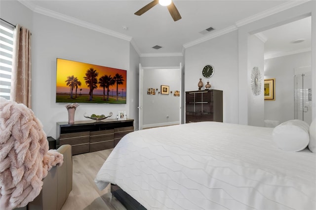 bedroom featuring crown molding, light hardwood / wood-style flooring, and ceiling fan