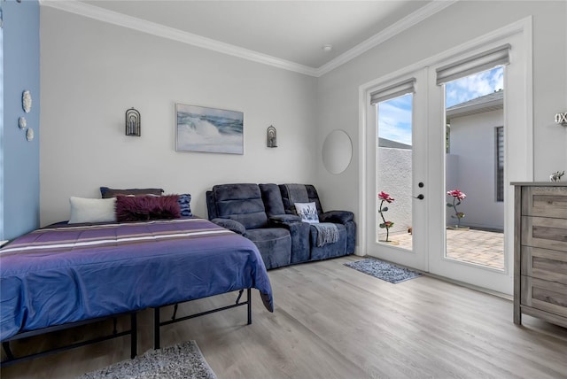 bedroom with light hardwood / wood-style floors, ornamental molding, access to outside, and french doors