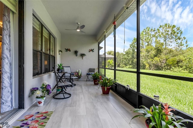 sunroom / solarium with ceiling fan