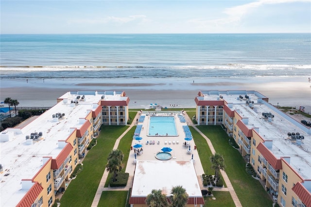 drone / aerial view with a water view and a view of the beach