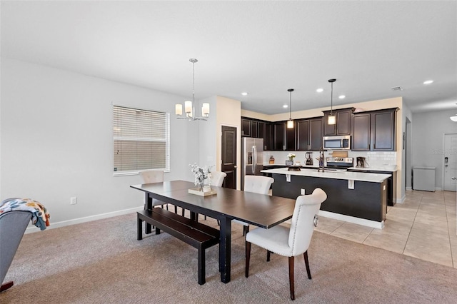 carpeted dining area with a chandelier