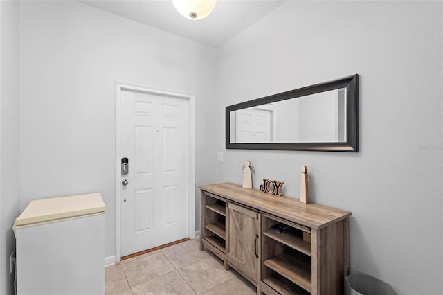 entryway featuring light tile patterned flooring