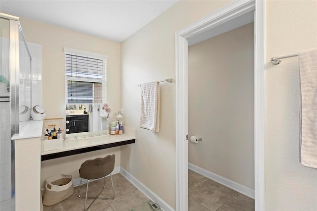 bathroom featuring tile patterned flooring and walk in shower