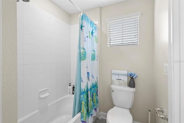 bathroom with shower / bath combination with curtain and toilet