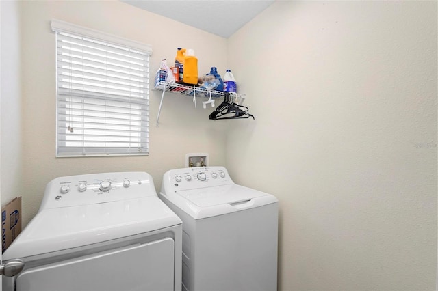 laundry room with washing machine and clothes dryer